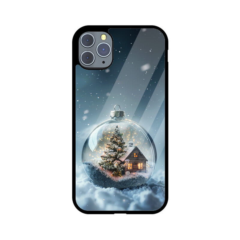 Glass Christmas ball with house and Christmas tree