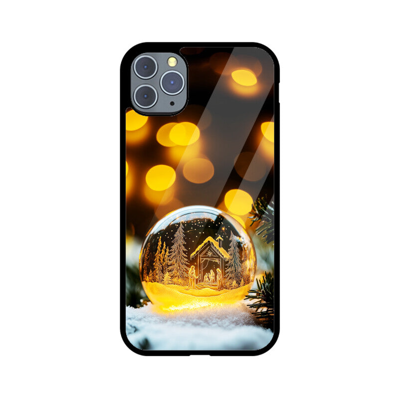 Christmas tree and house inside a glass ball
